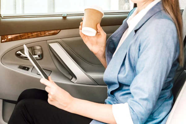 Businesswoman Work Digital Tablet Computer Holding Cup Coffee Back Seat — Stock Photo, Image