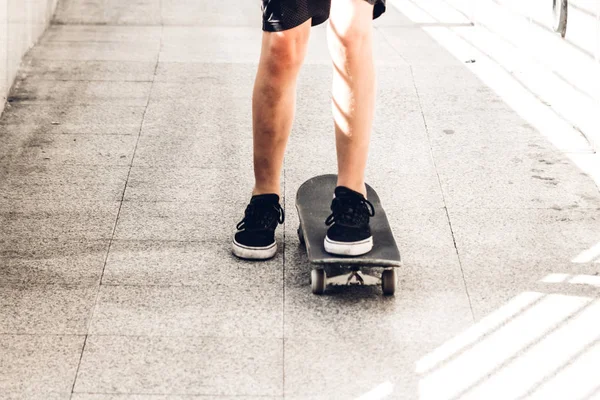 Kid play skateboard on the street