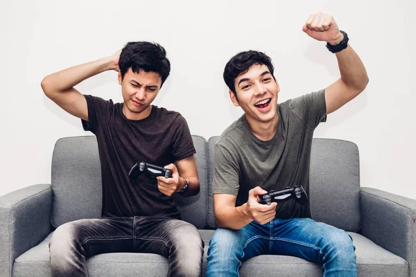 Two Friends Sitting Sofa Enjoying Play Video Game Together Home — Stock Photo, Image