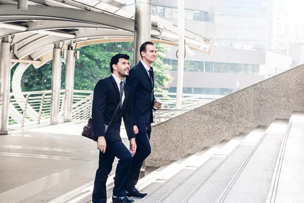 Two Smiling Businessman Coworkers Black Suit Talking Walking Business People — Stock Photo, Image