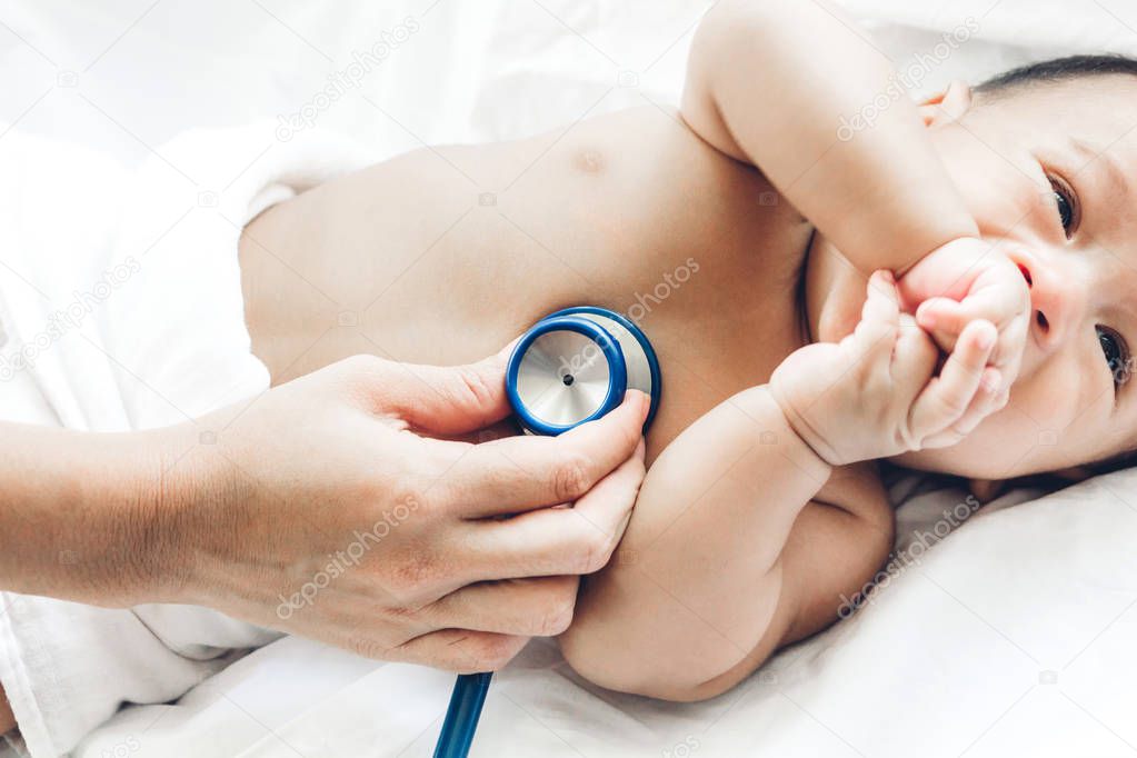 Doctor examining baby with stethoscope in the hospital.healthcare and medicine