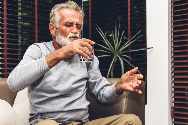 Senior Man Holding Bottle Pills Taking Medicine Glass Water Sitting — Stock Photo, Image