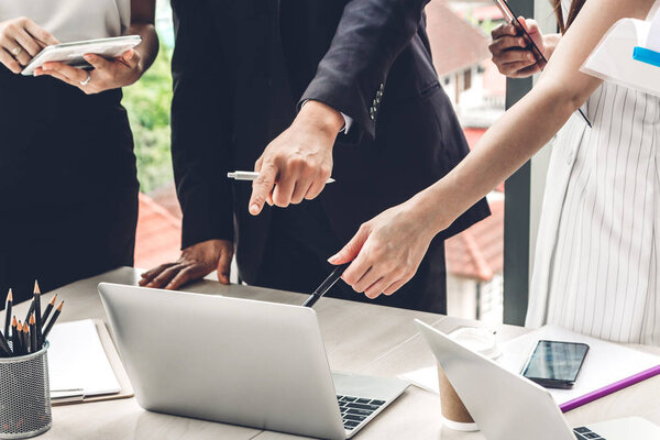 Group of casual business discussing and working with laptop computer.creative business people planning and brainstorm in modern workloft.Teamwork concept