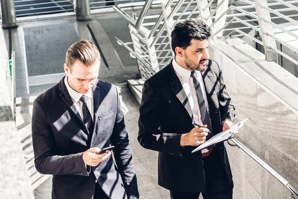 Two Smiling Businessman Coworkers Black Suit Talking Walking Business People — Stock Photo, Image