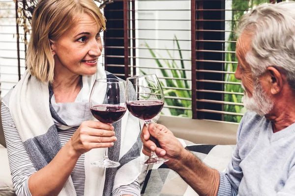 Senior Couple Relax Talking Drinking Wine Glasses Together Sofa Living — Stock Photo, Image