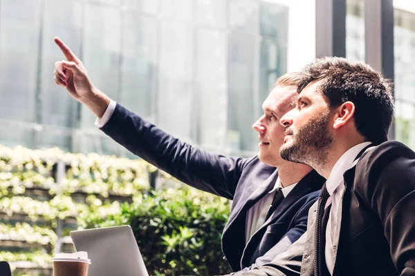 Image of two businessman coworkers in black suit talking and wor — Stock Photo, Image