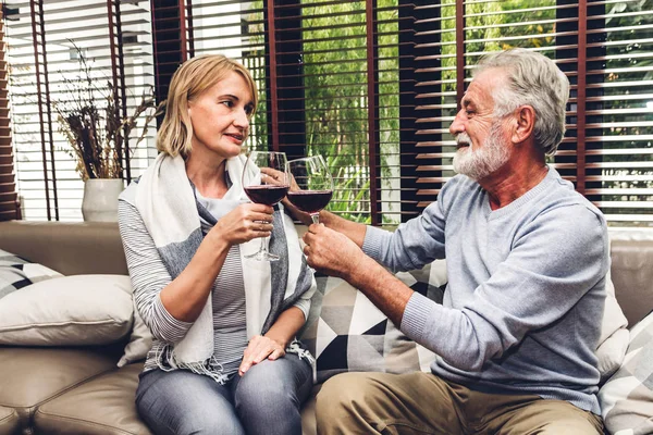 Senior couple relax talking and drinking wine glasses together o — Stock Photo, Image