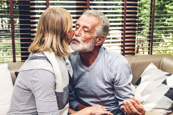 Senior man giving ring to wife and talking together sitting on s — Stock Photo, Image