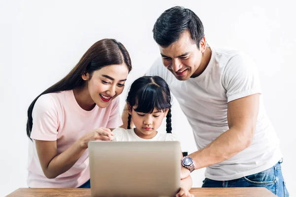 Happy family father and mother with daughter sitting and looking — Stock Photo, Image