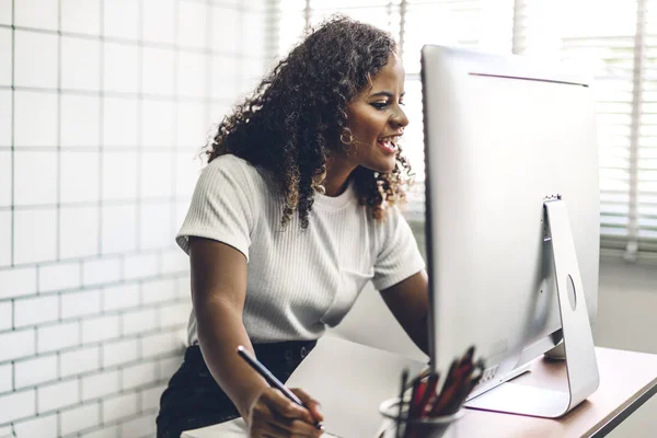 African american black woman working with laptop computer.creati