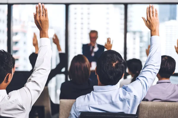 Businessman standing in front of group of people in consulting m — Stock Photo, Image