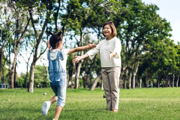 Portrait of happy grandmother and little cute girl enjoy relax t — Stock Photo, Image