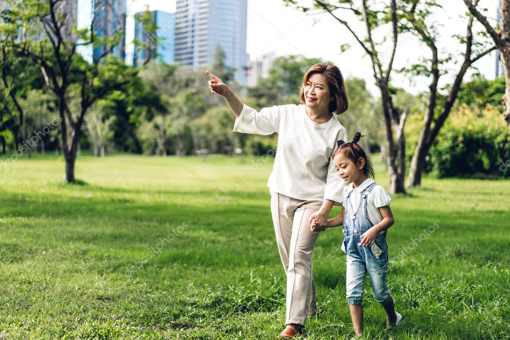 Portrait of happy grandmother and little cute girl enjoy relax t