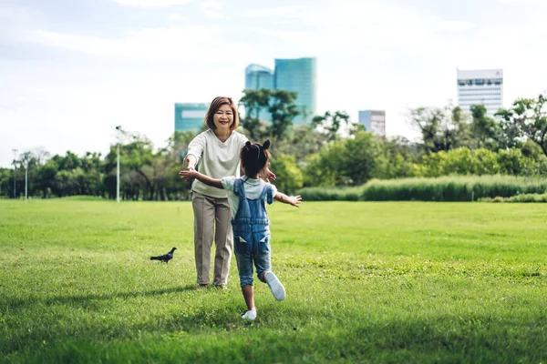 Portrait of happy grandmother and little cute girl enjoy relax t — Stock Photo, Image