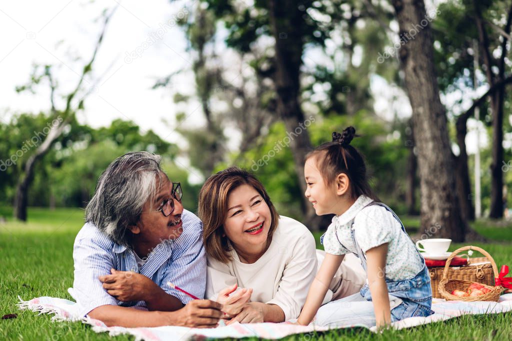 Portrait of happy grandfather with grandmother and little cute g