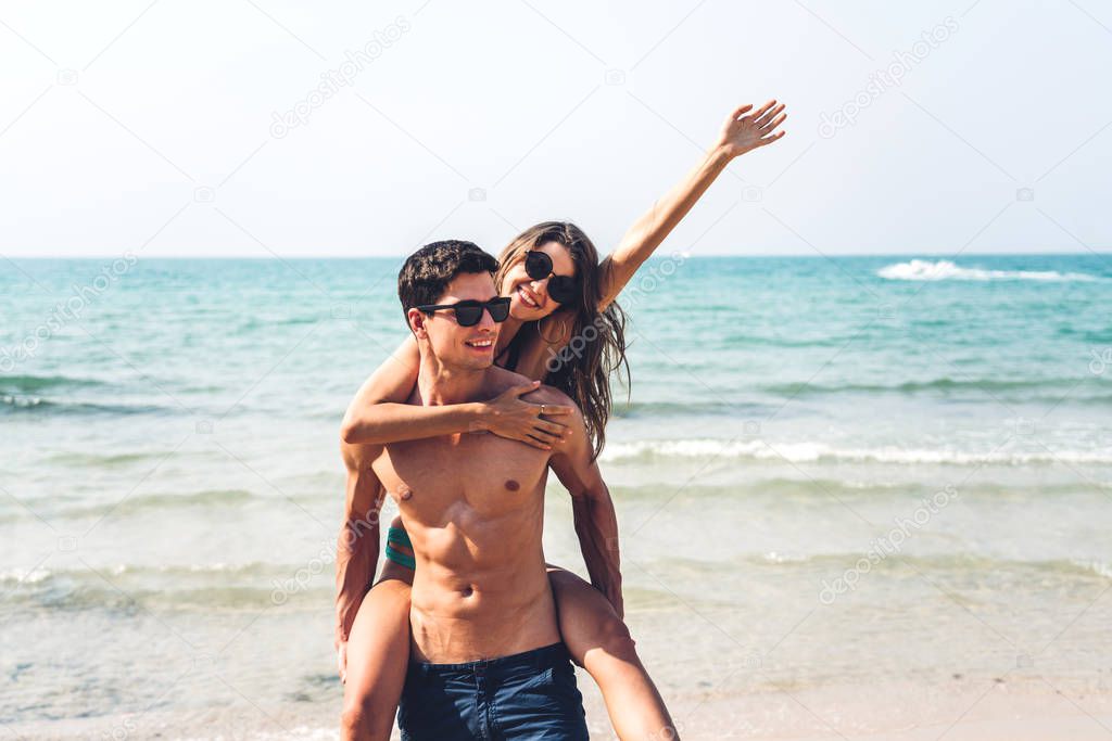 Romantic lovers young couple relaxing together on the tropical b