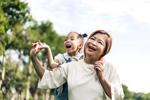 Portrait of happy grandmother and little cute girl enjoy relax t — Stock Photo, Image