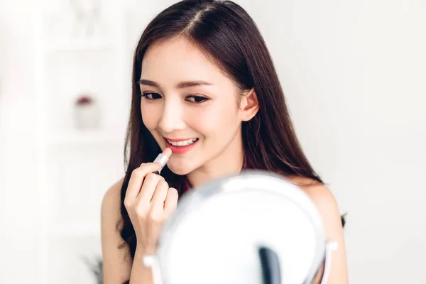 Smiling beautiful woman fresh healthy skin looking on mirror and — Stock Photo, Image