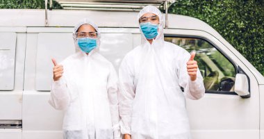 Professional teams for disinfection worker in protective mask and white suit disinfectant spray cleaning virus for help service kill coronavirus at customer home clipart