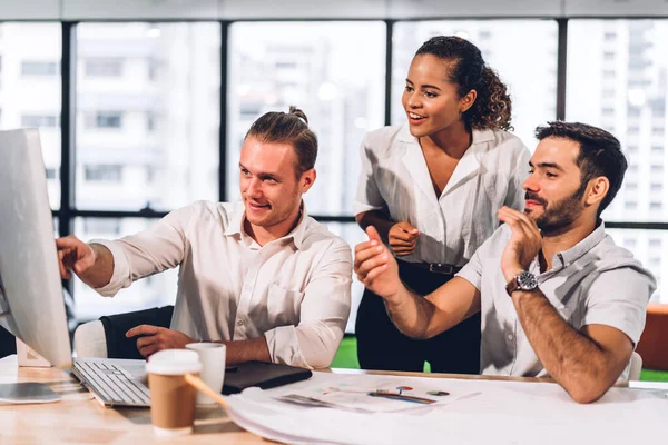 Group of professional business meeting and discussing strategy with new startup project.Creative business people planning and brainstorm with desktop computer in modern workloft.Teamwork concept