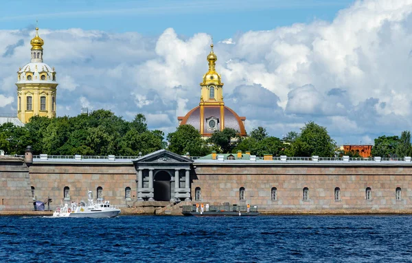 Raptor patrol boat with the coat of arms of the President of Russia on board is heading to the pier of the Peter and Paul fortress