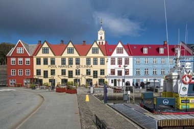 Torshavn, Faroe  July 11 2018  Vestaravag bay and Torshavn old quarters with quayside buildings, Faroese island of Streymoy clipart