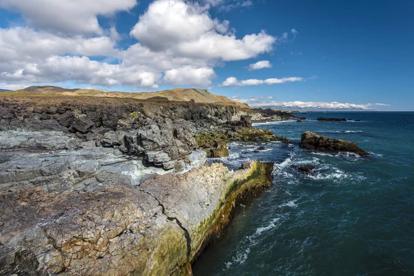 Rocky coastline as seen from Fauskasandur beach via Styrmisnes p — Stock Photo, Image