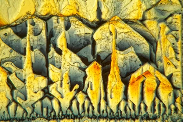 Symmetric grown crystals of Potassium ferricyanide under the microscope — Stock Photo, Image