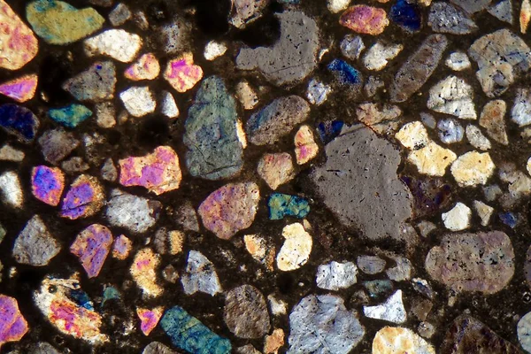 Thin section of concrete under a microscope and in cross polarized light — Stock Photo, Image