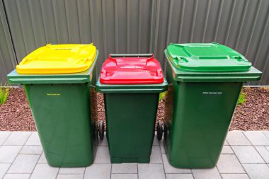 Australian home wheelie bins set on backyard clipart