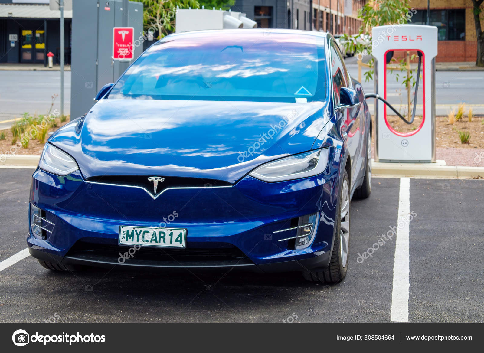 Tesla Model X Car Connected To Supercharger Stock