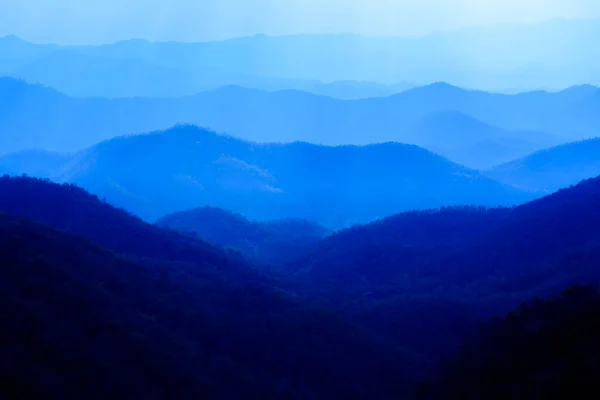 Beautiful landscape of blue mountains layers during sunset — Stock Photo, Image