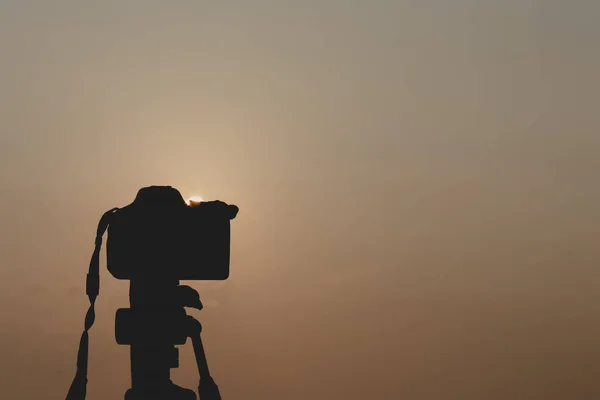 silhouette, camera and nature by the sea.