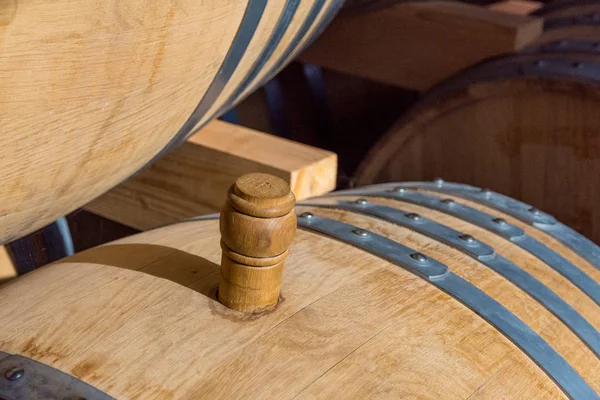 wine barrel made of oak wood filled with quality wine