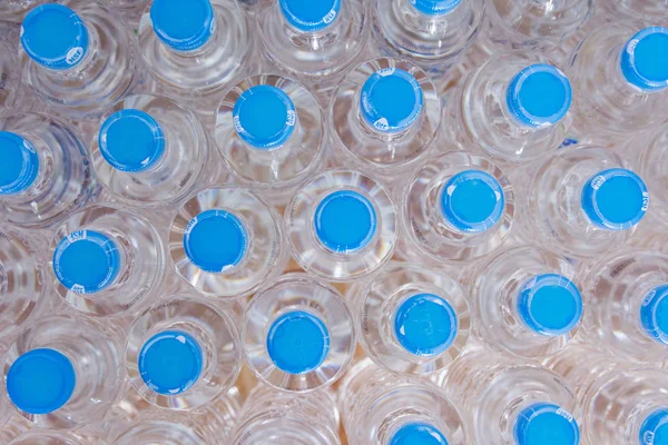 Rows of water plastic bottles and cap seal NSF us standard