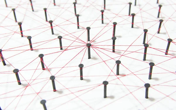 Linking entities, social media, Communications Network, The connection between the two networks. Network simulation on white paper linked together created by black nail and red threa