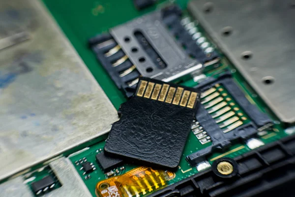 Micro sd card slot inside electronic circuit board smart phone. disassembled cell phone parts.