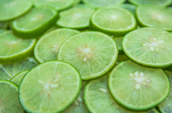Citrus fruit of lime slices background — Stock Photo, Image