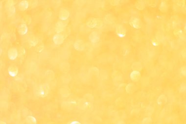 Odaklanmamış altın parıltısı arka planı. Altın soyut bokeh geri gruplandırması