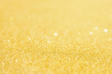 Odaklanmamış altın parıltısı arka planı. Altın soyut bokeh geri gruplandırması