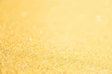 Odaklanmamış altın parıltısı arka planı. Altın soyut bokeh geri gruplandırması
