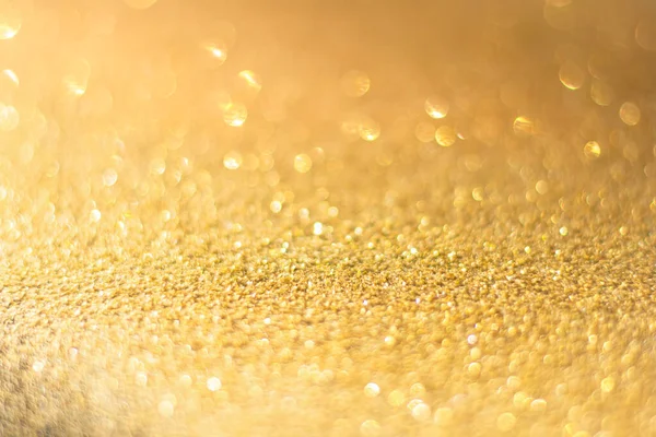 Rozostřené zlaté třpytky pozadí. Gold abstraktní bokeh backgroun — Stock fotografie