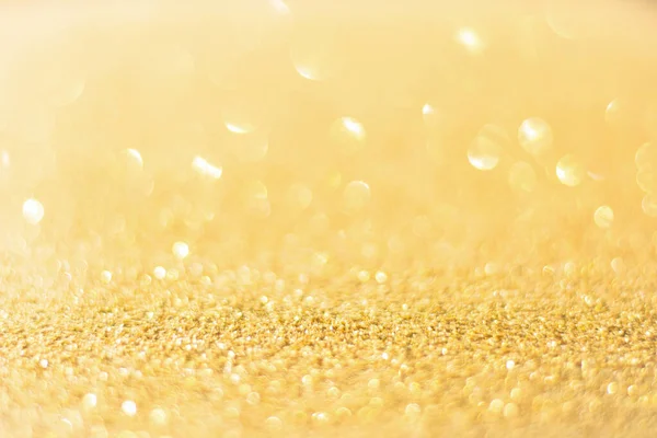Rozostřené zlaté třpytky pozadí. Gold abstraktní bokeh backgroun — Stock fotografie