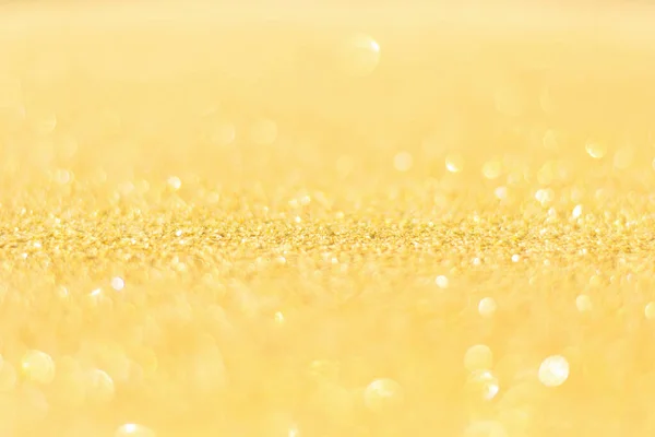 Defocused gold glitter background. Gold abstract bokeh backgroun — Stock Photo, Image