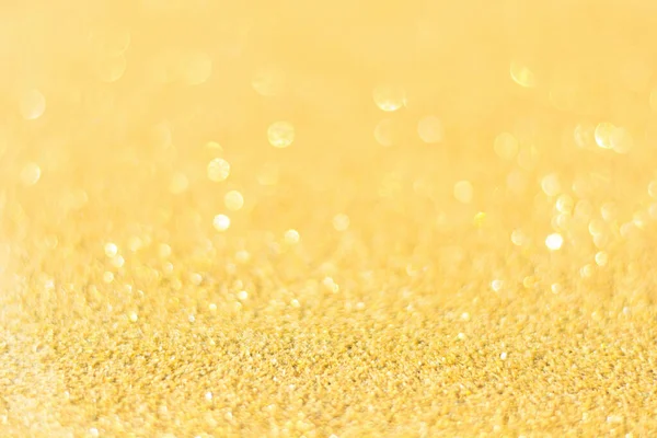 Defokussiert Goldglitzerhintergrund. Gold abstrakter Bokeh-Hintergrund — Stockfoto