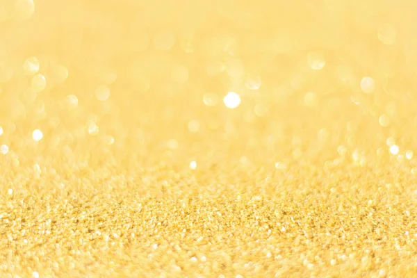 Rozproszone tło złotego brokatu. Gold abstrakcyjny bokeh backgroun — Zdjęcie stockowe