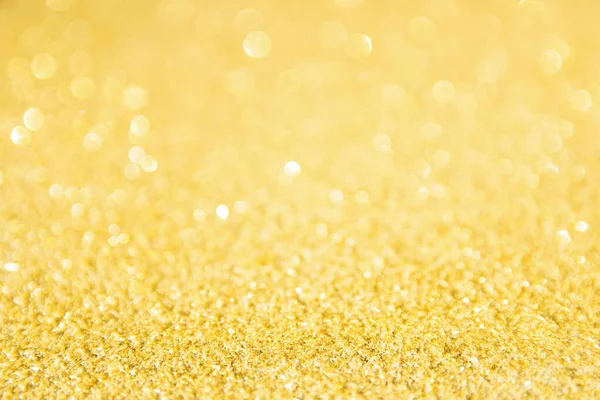 Oskärpa guld glitter bakgrund. Guldabstrakt bokeh backgroun — Stockfoto