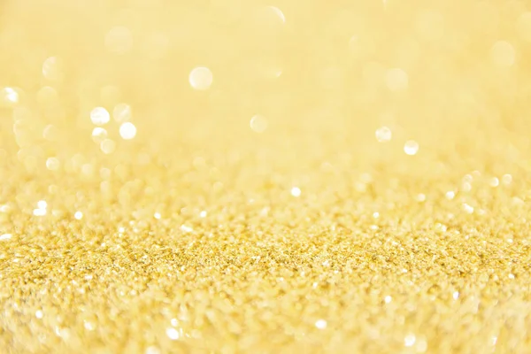 Rozproszone tło złotego brokatu. Gold abstrakcyjny bokeh backgroun — Zdjęcie stockowe
