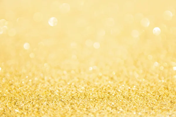 Oskärpa guld glitter bakgrund. Guldabstrakt bokeh backgroun — Stockfoto