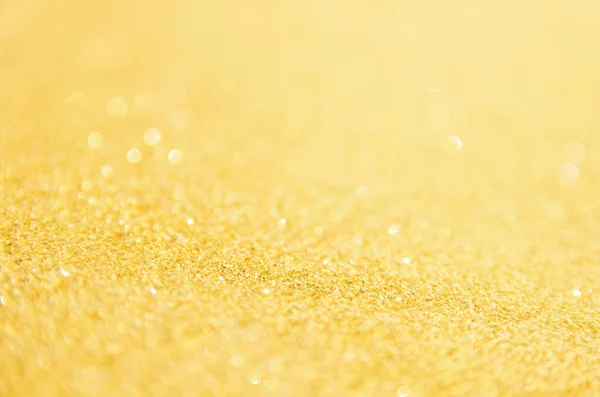 Oskärpa guld glitter bakgrund. Guldabstrakt bokeh backgroun — Stockfoto